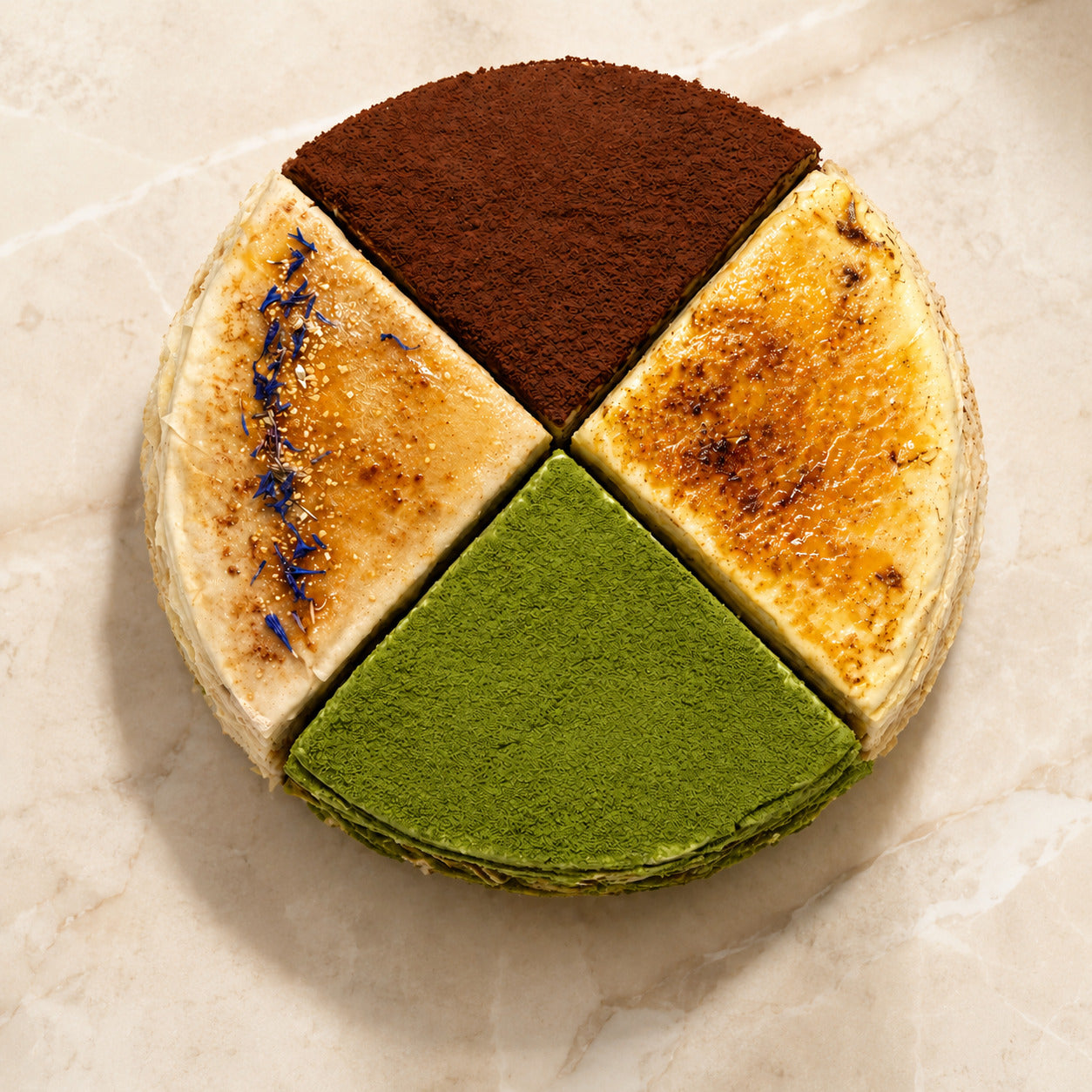 Four-flavour crepe cake quartered into tiramisu, creme brulee, earl grey and matcha
